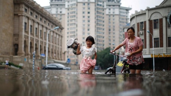 China rainstorms death toll at 128